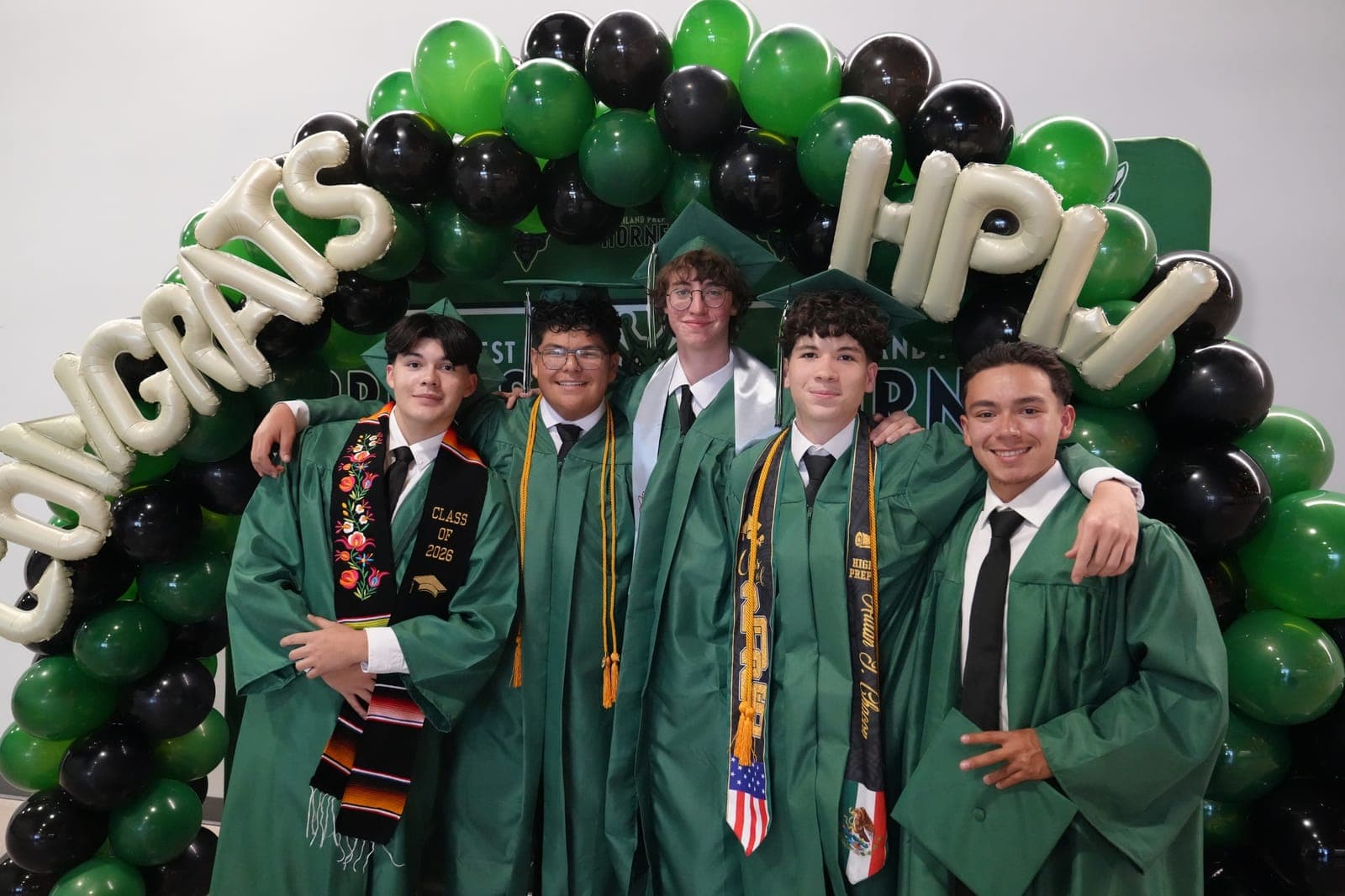 Highland Prep West graduates in caps and gowns at commencement