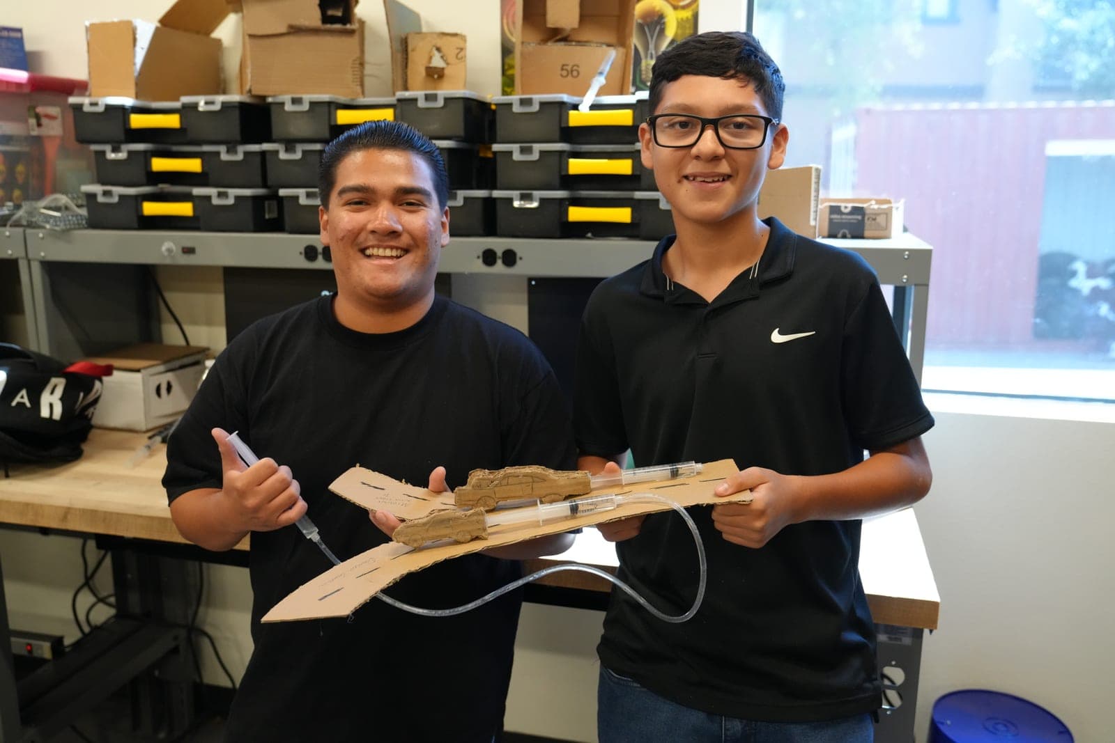 Highland Prep West students with a balsa wood engineering project
