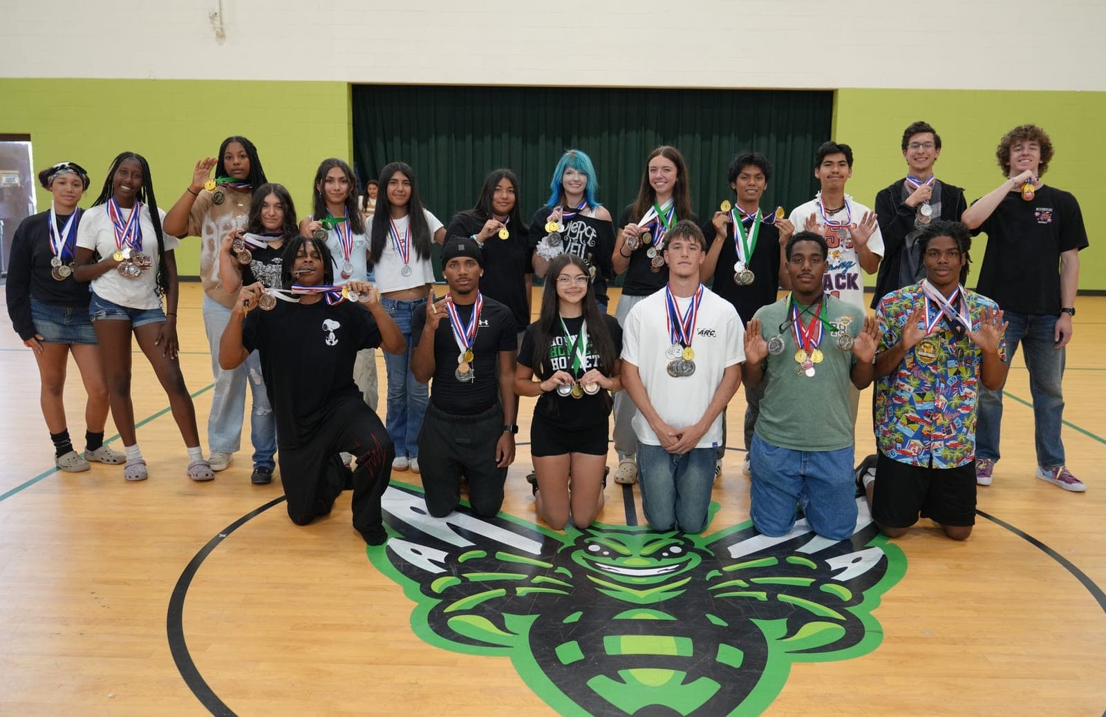Highland Prep West track athletes with their medals