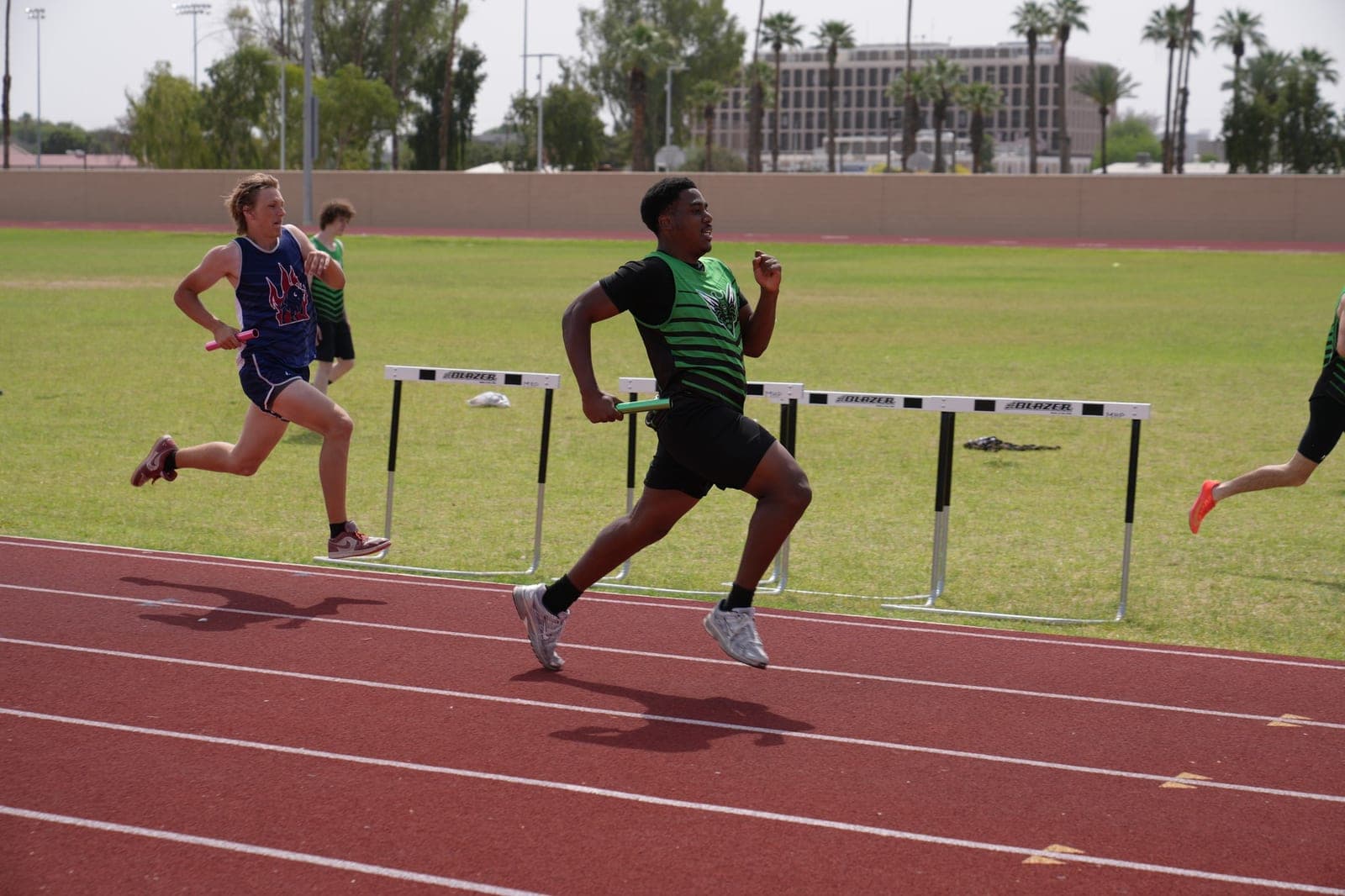 A Highland Prep West track and field athlete mid-race